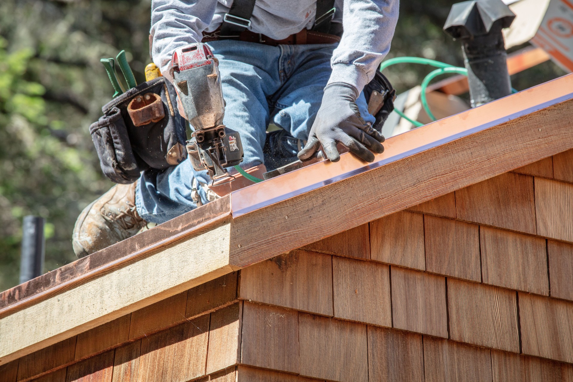 Installing new roof with nail gun